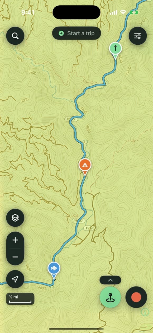 Second Kick Maps showing a recorded backcountry ride tracing a forest road on the on-device vector topo — with campsite and waypoint pins dropped along the track amid labelled contours and a dense trail network